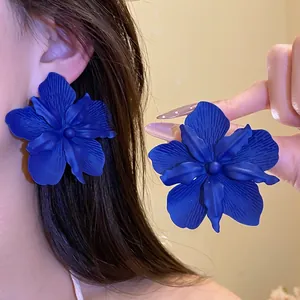Large Klein blue floral stud earrings for women featuring artistic vacation style design