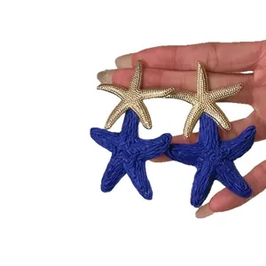 Bohemian raffia starfish drop earrings with gold textured studs for beach vacation
