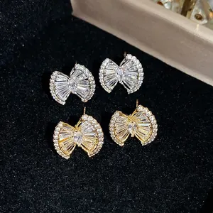 Elegant 18k gold plated bow-shaped stud earrings with sparkling zircon stones