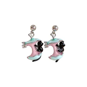 Whimsical black cat climbing a bitten apple core drop earrings in pink and mint green