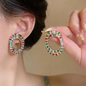 Elegant oval hoop earrings with colorful baguette zircon stones for women.