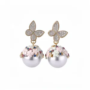 Elegant gold butterfly and floral pearl drop earrings with sparkling crystal pave