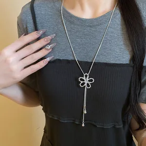 Exquisite zircon hollow flower slider necklace shown as a detailed fashion accessory