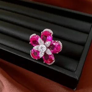 Exquisite close-up of pink cubic zirconia flower ring with 18k gold plating details