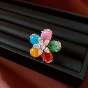 Detailed view of an 18k gold-plated open ring with colorful zircon flower petals.