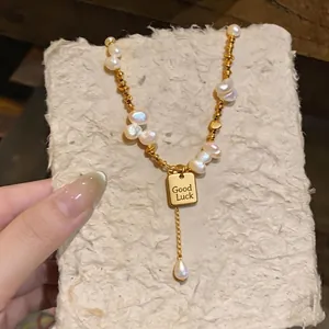 Handmade gold baroque pearl necklace with square Good Luck pendant and drop pearl