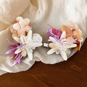 Exquisite beach style seashell hair clip featuring starfish and fabric flower pearl accents