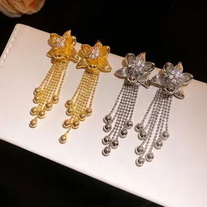 Elegant 18K gold plated flower earrings with zircon and dangling ball tassels