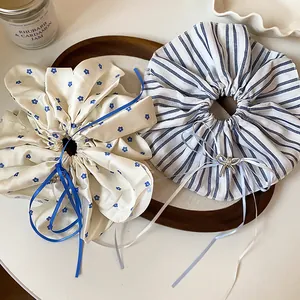 Detail of elegant floral and striped scrunchies with delicate bow ribbons