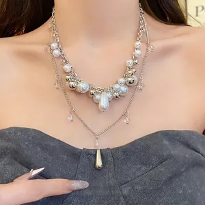Elegant multi-layered French style pearl necklace featuring a chic metallic drop pendant charm