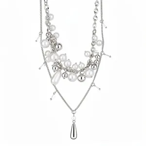 Elegant French multi-layer pearl necklace with silver beads and chains on white background.
