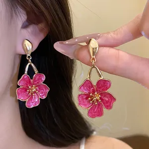 Exquisite vintage pink enamel flower drop earrings with a gold-tone finish for women