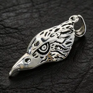 Detail view of a punk-style stainless steel eagle head pendant with retro textures.