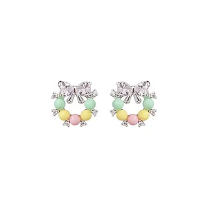 Ravissantes boucles d'oreilles nœud avec zircons brillants et perles pastel pour femmes
