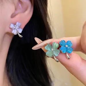 Exquisite cat's eye stone four-leaf clover stud earrings with sparkling center rhinestone