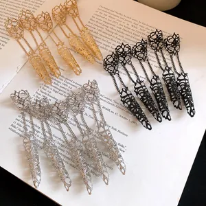 Detail view of Gothic hollow-out finger armor rings in gold, silver, and black finishes.