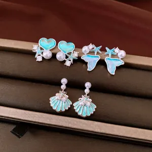 Elegant silver needle shell and pearl earrings with turquoise drip oil for beach vacation