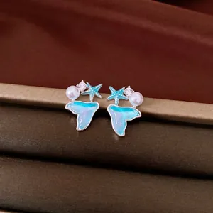Elegant starfish and mermaid tail pearl stud earrings with sparkling cubic zirconia