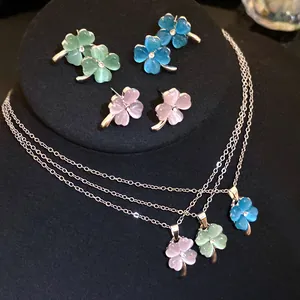 Exquisite detail of cat's eye stone four-leaf clover earring and necklace jewelry set