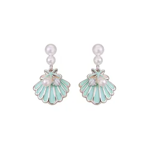 Elegant silver needle drop earrings featuring mint green shell, pearls and zircons