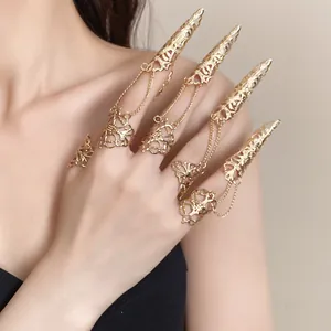 Gothic gold hollow claw rings set with chains for a bold fashion statement.