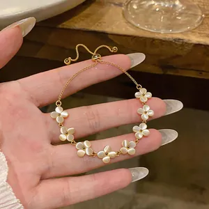 Elegant gold-plated cat's eye stone flower bracelet with adjustable sliding clasp for women