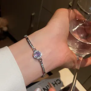 Close-up of a vintage-style round zircon bracelet with sparkling purple center stone