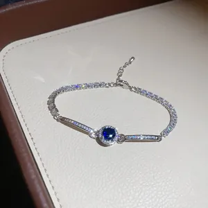 Close-up detail of a vintage style silver bracelet featuring a sparkling blue zircon stone