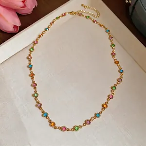 Delicate gold clavicle chain with colorful round resin pendants for a chic look
