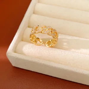 Close-up of a 14k gold plated chain link ring with zircon inlay in a jewelry box.