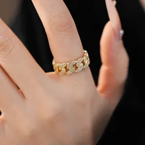 Detailed view of an elegant 14k gold-plated chain ring inlaid with shimmering zircons