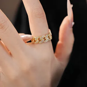 Detailed close-up showing a 14k gold-plated Cuban link ring with pavé-set zircons