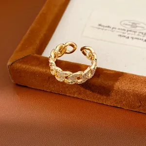 Detailed close-up view of a 14k gold-plated chain link open ring with sparkling zirconia stones