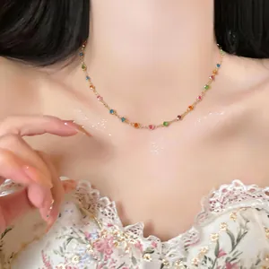 Detailed shot of a dainty colorful resin circular choker necklace worn by a model