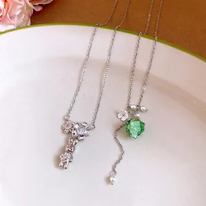 Exquisite stainless steel necklaces featuring silver rabbit and green resin grape pendants