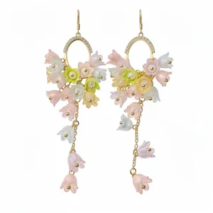Elegant floral tassel dangle earrings with crystals and pastel lily-of-the-valley flowers