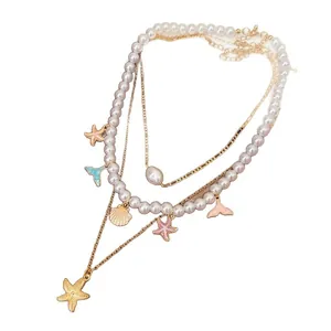 Multi-layer pearl necklace with starfish and mermaid tail charms for beach vacation style