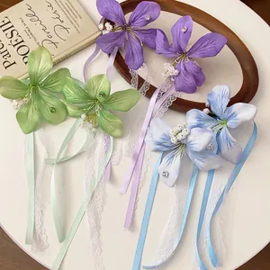 Exquisite lace and fabric flower hair clips with colorful ribbons and mini pearls