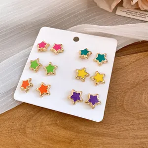 Close-up of 12pc colorful star stud earrings set with enamel finish and gold trim
