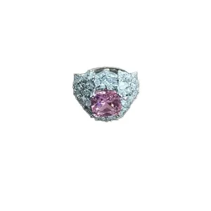 Elegant princess style pink stone ring with sparkling diamond clusters on silver band