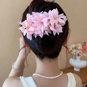 Exquisite Korean style pink fabric flower hair clip with realistic dewdrop detail for women