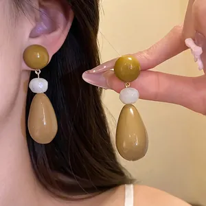 Elegant vintage resin teardrop drop earrings featuring olive green and tan beads for women