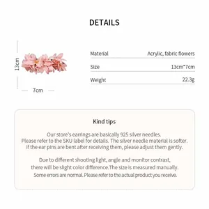 Detailed view of pink fabric floral hair clip with 13cm dimensions and weight info