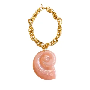 Elegant pink acrylic conch shell pendant necklace with chunky gold chain for beach vacations