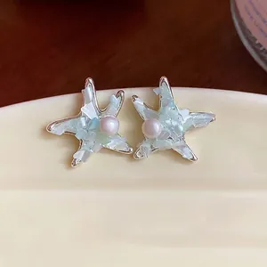 Elegant silver starfish pearl stud earrings with mint green stone inlay for women