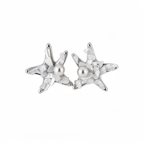 Elegant starfish pearl stud earrings with silver needles for a minimalist ocean style.