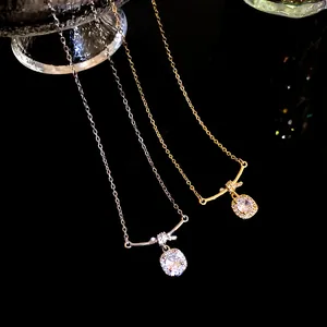 Close-up macro view of gold and silver plated necklaces with square zircon stone pendants