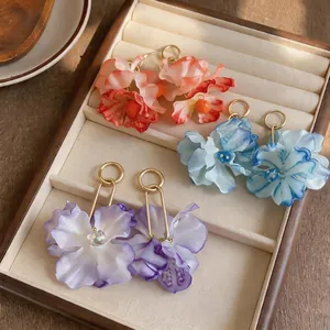Elegant oversized floral fabric stud earrings with gold loops for beach vacation