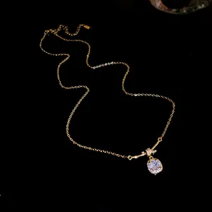 Elegant close-up of a sparkling square zircon pendant on 14K gold plated necklace chain