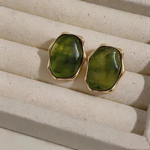 Vintage olive green resin stud earrings with gold wavy border